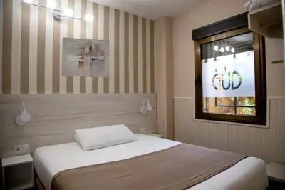 Cama o camas de una habitación en Hostal Gud Salamanca