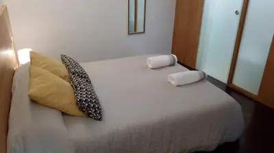 Cama o camas de una habitación en Apartamentos 14DeSande