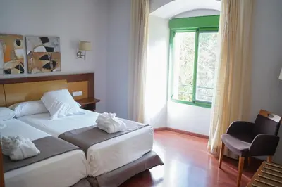 Cama o camas de una habitación en Salugral Termal Resort