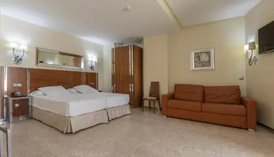 Cama o camas de una habitación en Gran Hotel Corona Sol