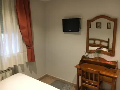 Cama o camas de una habitación en Hostal El Pinar