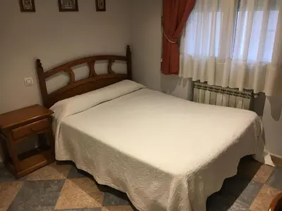 Cama o camas de una habitación en Hostal El Pinar