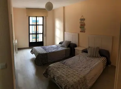Cama o camas de una habitación en San Juan de la Cruz con garaje incluido