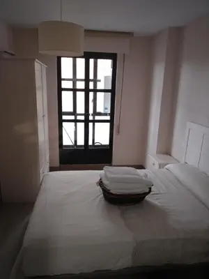 Cama o camas de una habitación en San Juan de la Cruz con garaje incluido