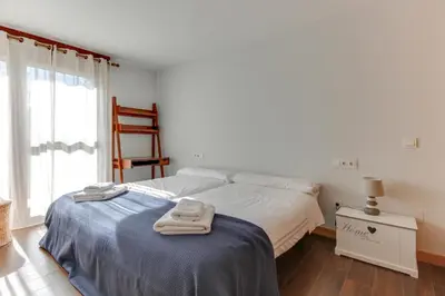 Cama o camas de una habitación en Apartamentos Suites&Homes