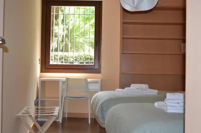 Cama o camas de una habitación en Apartamentos Suites&Homes