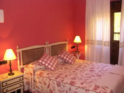 Cama o camas de una habitación en Hotel Posada Molino del Cubo