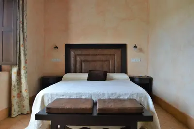 Cama o camas de una habitación en Apartamentos Turísticos - Hostal Los Alisos