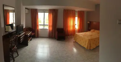 Cama o camas de una habitación en Hotel Perales