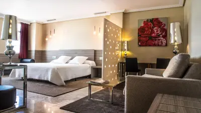 Cama o camas de una habitación en Hospedium Hotel Triana