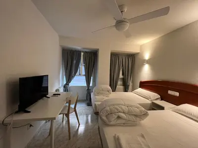 Cama o camas de una habitación en Hostal la Embajada
