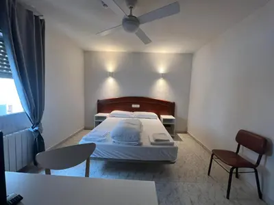 Cama o camas de una habitación en Hostal la Embajada