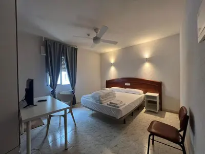 Cama o camas de una habitación en Hostal la Embajada