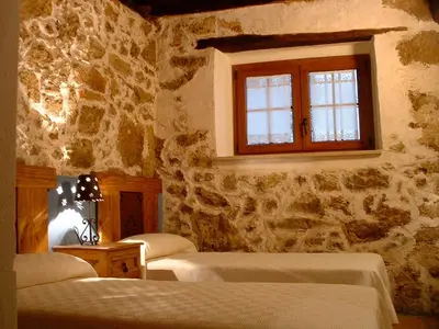 Cama o camas de una habitación en Apartamentos Rurales La Antigua Fonda