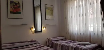 Cama o camas de una habitación en Pension Salamanca