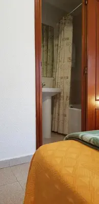 Cama o camas de una habitación en Pension Salamanca