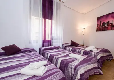 Cama o camas de una habitación en Pension Salamanca