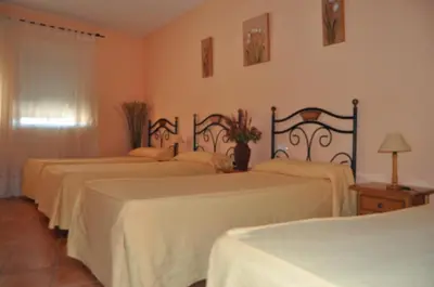 Cama o camas de una habitación en Hostal Paulino