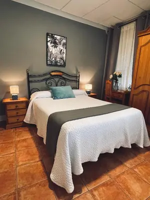 Cama o camas de una habitación en Hostal Paulino