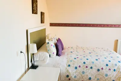 Cama o camas de una habitación en Aticos La Aliseda by Valdesierra