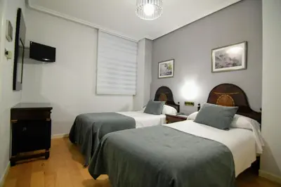 Cama o camas de una habitación en Hospedium Plaza Mayor Salamanca