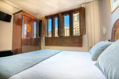 Cama o camas de una habitación en Hospedium Plaza Mayor Salamanca