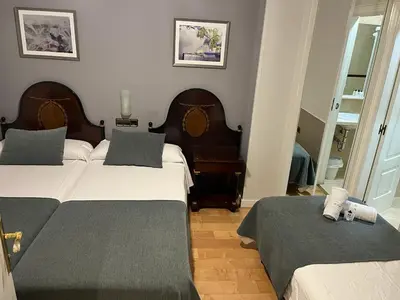 Cama o camas de una habitación en Hospedium Plaza Mayor Salamanca