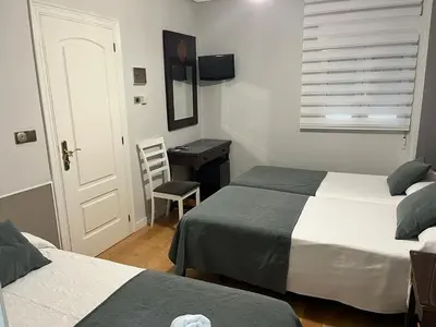 Cama o camas de una habitación en Hospedium Plaza Mayor Salamanca
