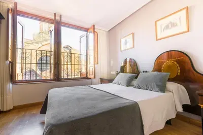 Cama o camas de una habitación en Hospedium Plaza Mayor Salamanca