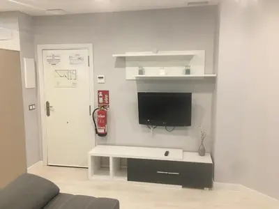 Una televisión o centro de entretenimiento en Apartamento Ausonio 2 dormitorios