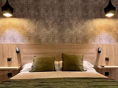 Cama o camas de una habitación en Hospedium Hotel La Fuente