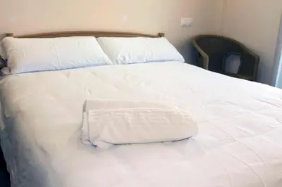 Cama o camas de una habitación en LA COCHERA