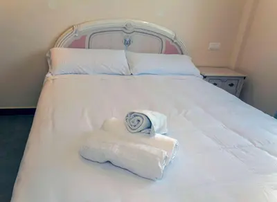 Cama o camas de una habitación en LA COCHERA