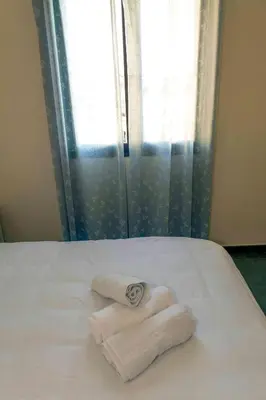 Cama o camas de una habitación en LA COCHERA