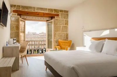 Cama o camas de una habitación en Salamanca Luxury Plaza