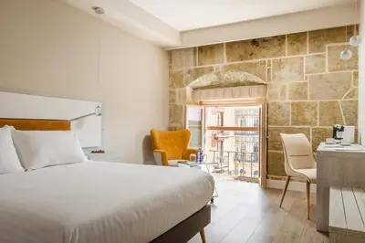 Cama o camas de una habitación en Salamanca Luxury Plaza