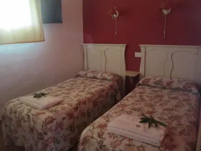 Cama o camas de una habitación en Los Chozos de la Roca