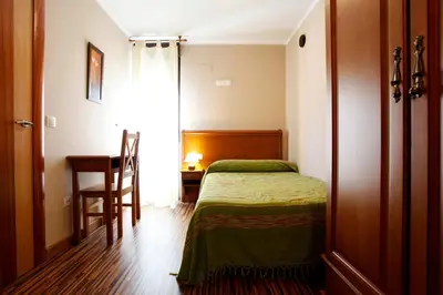 Cama o camas de una habitación en Apartamentos Hervasypunto