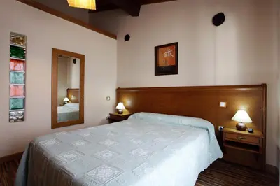 Cama o camas de una habitación en Apartamentos Hervasypunto