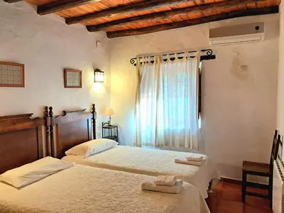 Cama o camas de una habitación en El Jiniebro Turismo Rural