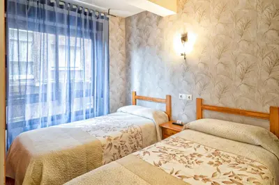 Cama o camas de una habitación en Pension La Playa