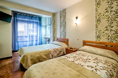 Cama o camas de una habitación en Pension La Playa