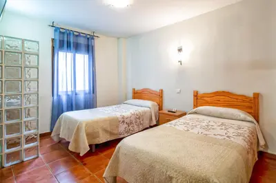 Cama o camas de una habitación en Pension La Playa