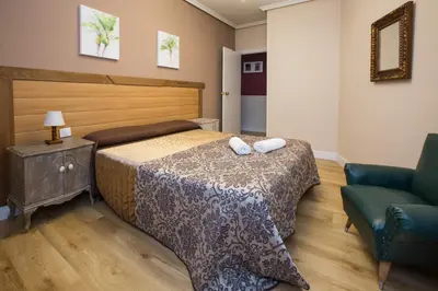 Cama o camas de una habitación en Apartamentos turisticos Avila La Catedral