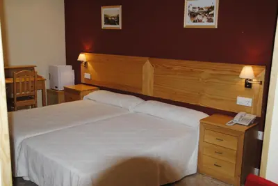 Cama o camas de una habitación en Hotel Alegría