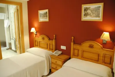 Cama o camas de una habitación en Hotel Alegría