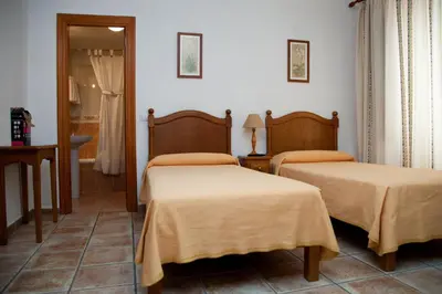 Cama o camas de una habitación en Hostal El Rincón