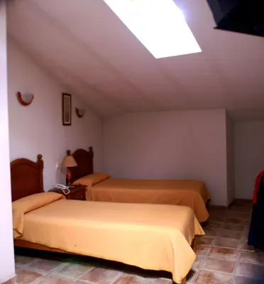 Cama o camas de una habitación en Hostal El Rincón