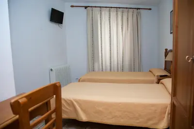 Cama o camas de una habitación en Hostal El Rincón