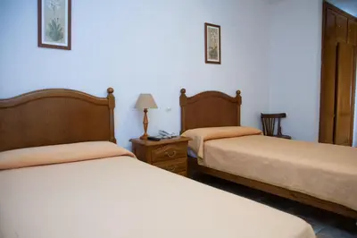 Cama o camas de una habitación en Hostal El Rincón